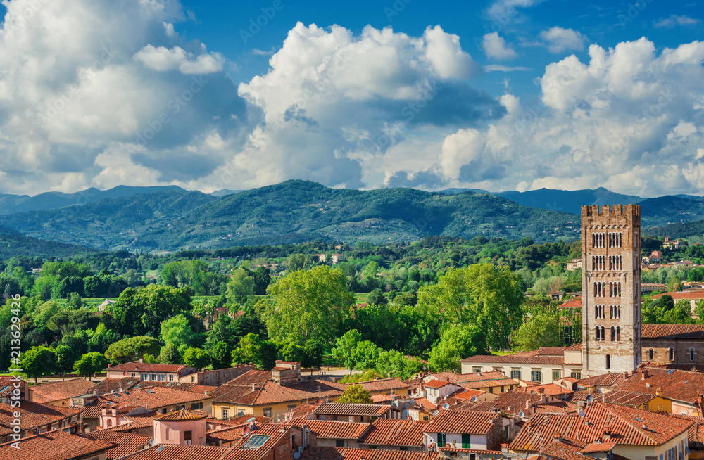 Panorama of the medieval center of Lucca with the romanesque Basilica of San Frediano (St Fridianus)  and the Apennines mountains in the background