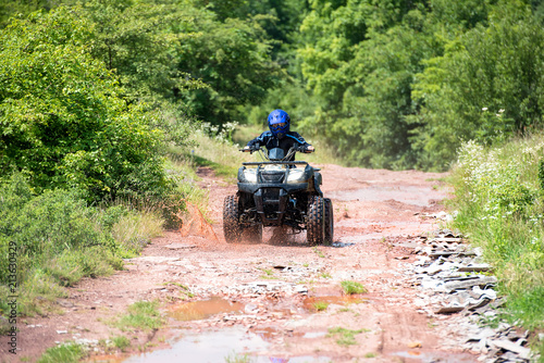A trip on the ATV on the red road.