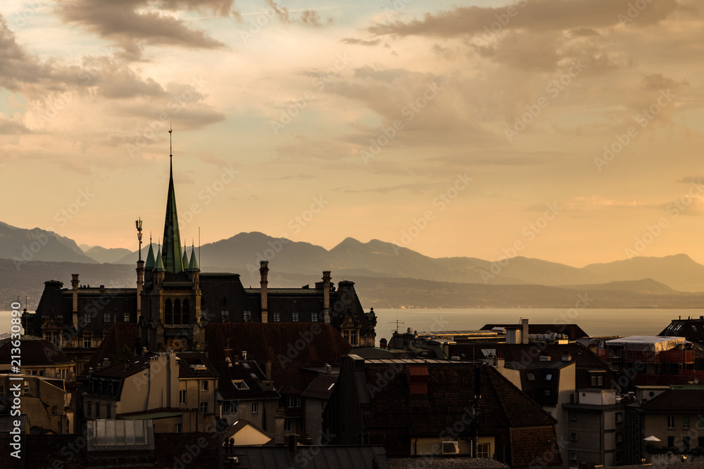 Sunset over Lausanne with the lake Geneva and the alps mountain in Canton Vaud largest city in Switzerland