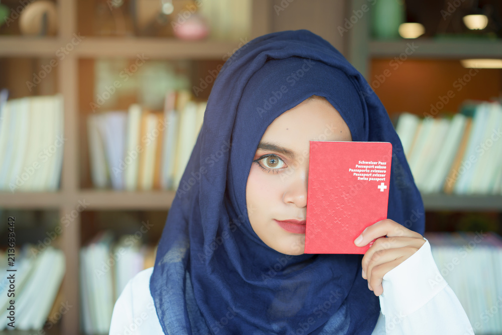 Muslim Girl Showing A Swiss Passport Book With A Happy Face Stock 
