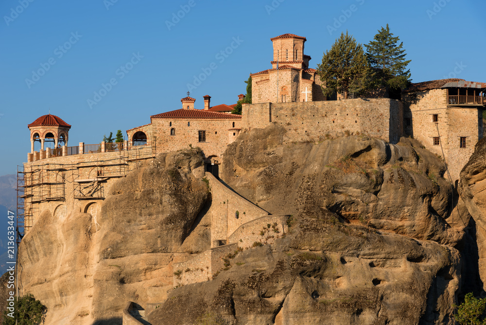 Great Meteoron Monastery. Beautiful scenic view, ancient traditional greek building on the top of huge stone pillar in Meteora,Thessaly, Greece, Europe Great Meteoron Monastery. Beautiful scenic view, ancient traditional greek building on the top of huge stone pillar in Meteora,Thessaly, Greece, Europe