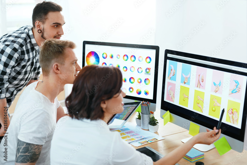 Web Design. Team Of Designers Working On Computer In Office Web Design. Team Of Designers Working On Computer In Office