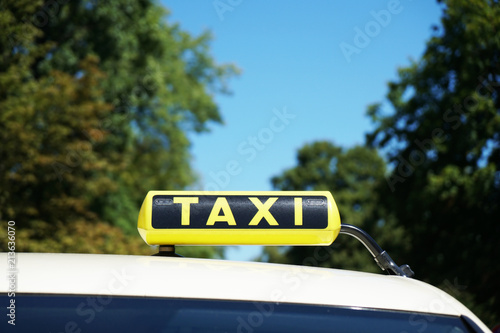 german taxi sign on car roof