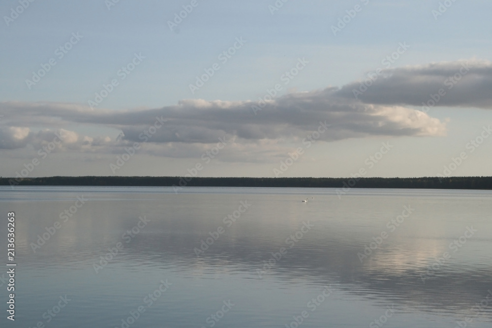 Sights of Belarus. Lake Naroch. Reflection of the evening sky in the lake.