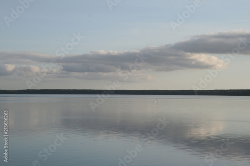 Sights of Belarus. Lake Naroch. Reflection of the evening sky in the lake. © Volha