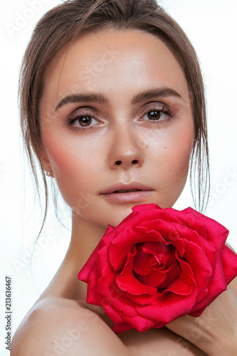 beauty portrait of a girl with red rose