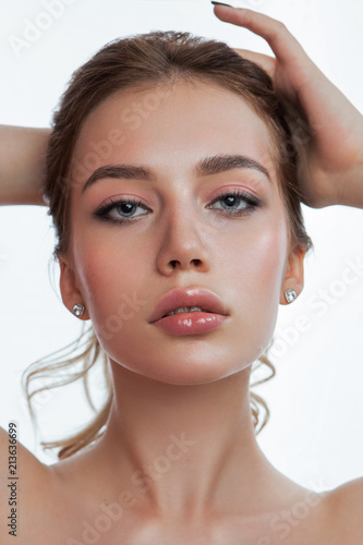 beauty portrait of young female with hands