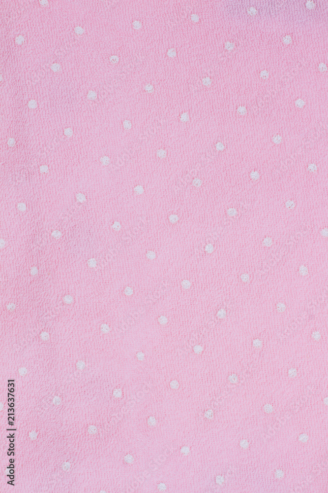 Pink dotted clothes texture. Pink dotted clothes texture.
