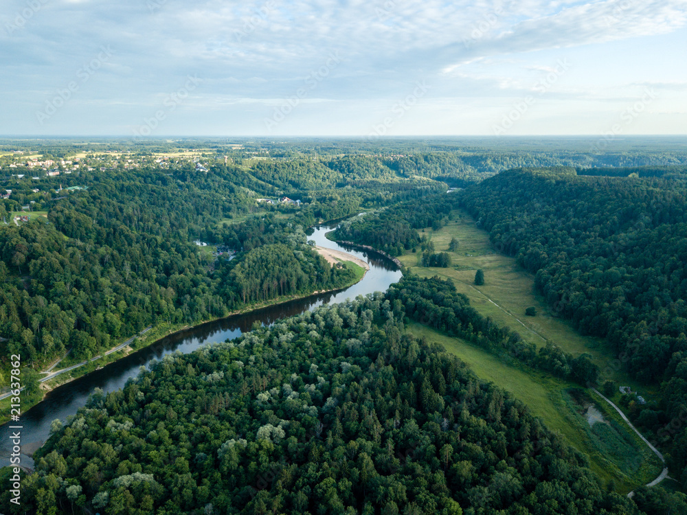 drone image. aerial view of forests and river Gauja in the middle in summer day. Latvia, Sigulda municipality