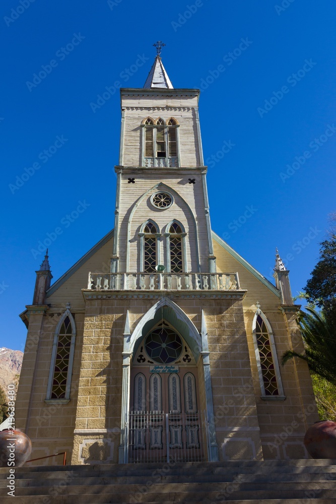 Front view of Elqui Valley church with blue sky on the background, Chile. Catholic religion architecture building