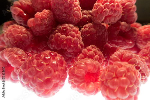Fototapeta Naklejka Na Ścianę i Meble -  bright colorful raspberry on a white background