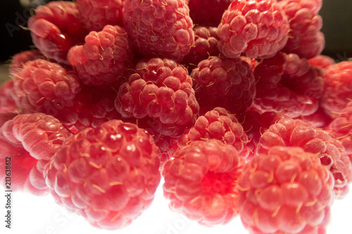 Fototapeta Naklejka Na Ścianę i Meble -  bright colorful raspberry on a white background