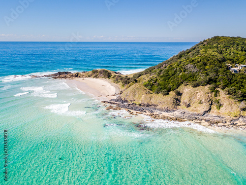 Fototapeta Naklejka Na Ścianę i Meble -  The Pass and Wategoes Beach at Byron Bay from an aerial view with blue water