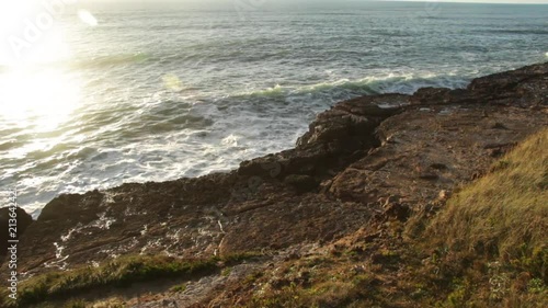 Landscape of waves breaking at a coastal beach. photo