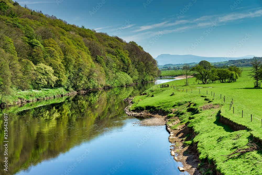 The River Lune near Lancaster flowing through lush green country The River Lune near Lancaster flowing through lush green country