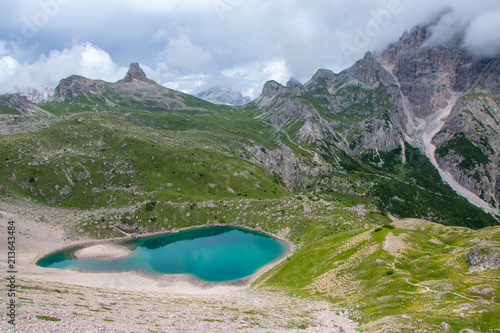 Amazing lake with azure water in Dolomite Alps photo