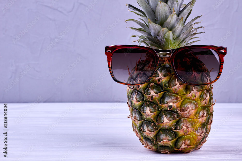 Ananas in sunglasses copy space. Fresh realistic pineapple fruit wearing sunglasses background. Stock-foto | Adobe Stock
