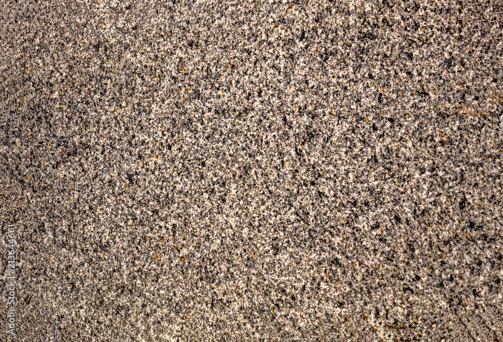 The texture of a stone fence made of granite. Background The texture of a stone fence made of granite. Background