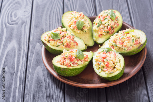 Avocado stuffed with cucumber , tomatoes and eggs