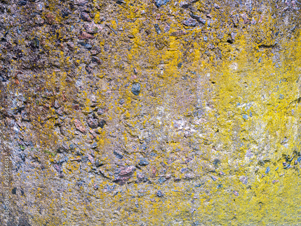 The texture of a stone fence made of granite. Background The texture of a stone fence made of granite. Background