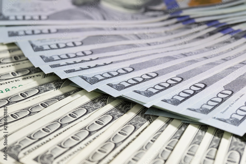 One hundred dollar bills folded in a fan. A lot of dollars