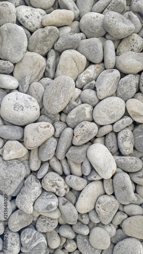 Sea round glossy stones background, top view. Sea round glossy stones background, top view.