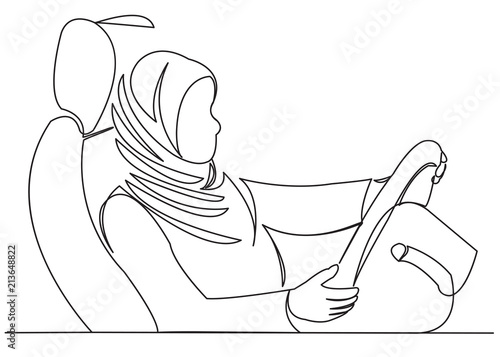 muslim woman driving a car