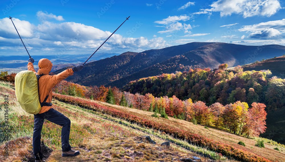 Obraz premium Hiker enjoying the trip in the top of mountain.