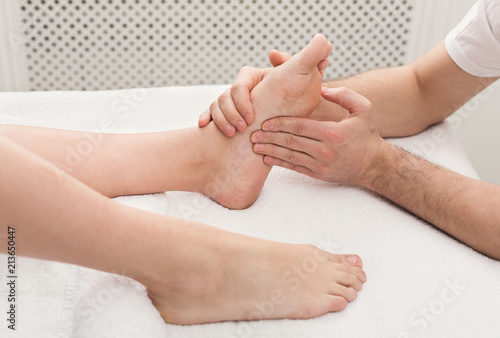 Feet massage closeup, acupressure