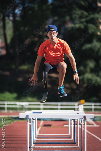 Disabled man athlete training with leg prosthesis