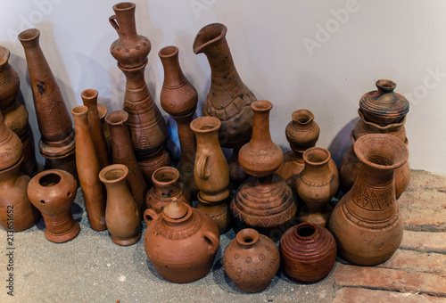 brown clay pots close-up isolated on a white wall background