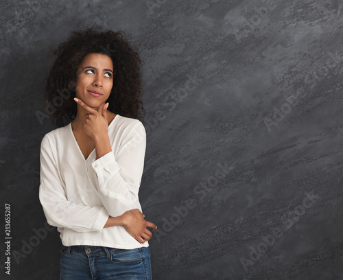 Young african-american woman thinking photo