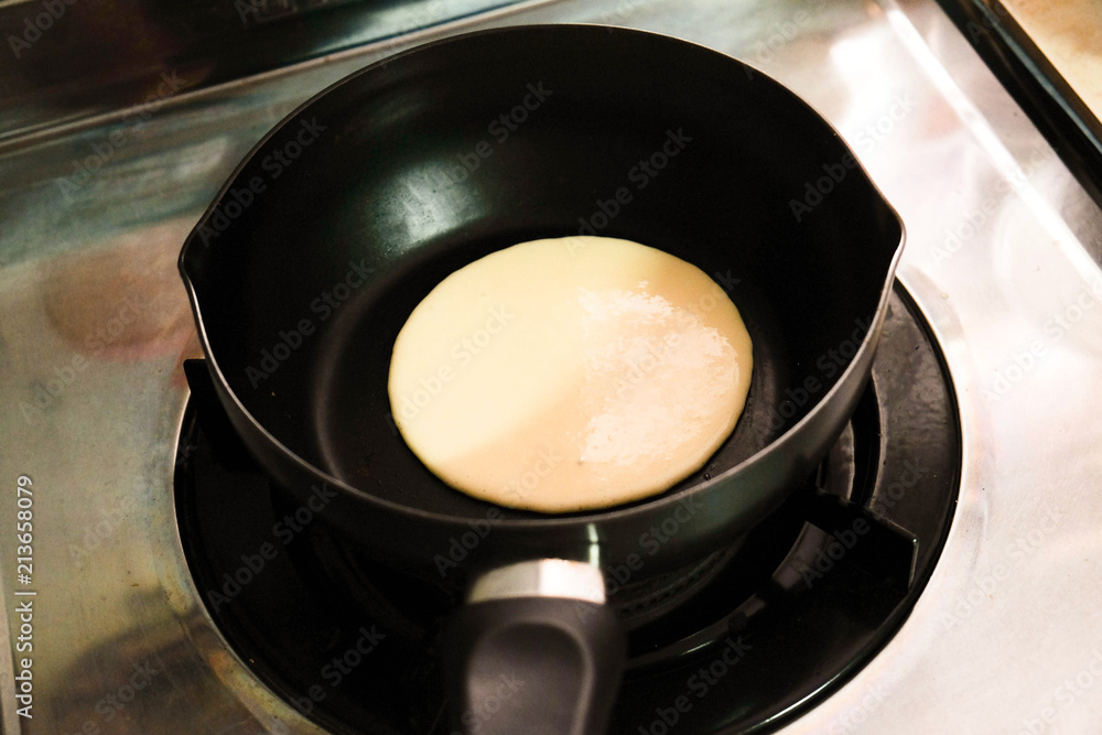 Making pancakes on frying pan , top view. Making pancakes on frying pan , top view.
