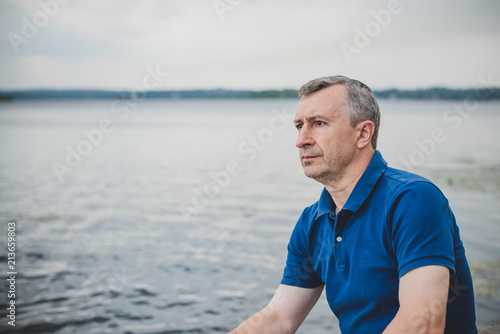 Mature European man with a sad philosophical mood. The concept of life after 50 years, problems and depression. Crisis of middle age 