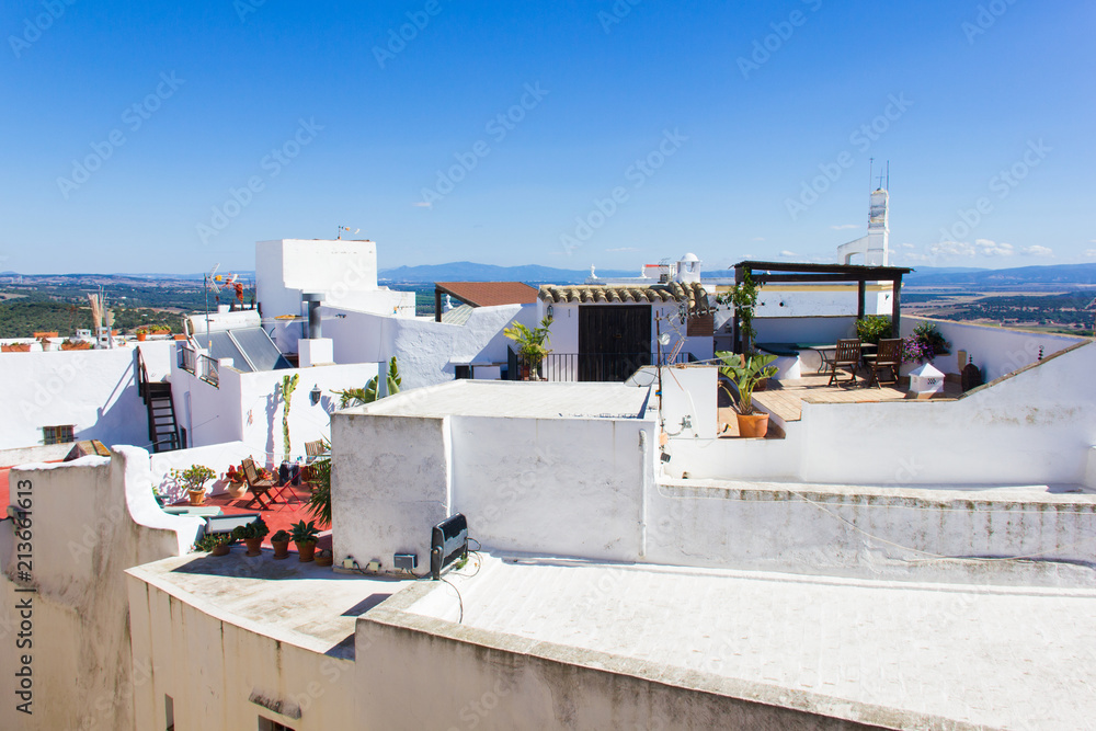 Fototapeta premium Views of roof terraces on beautiful sunny day in Vejer white town, Spain. Guided tour, summer vacation, travel destination concepts