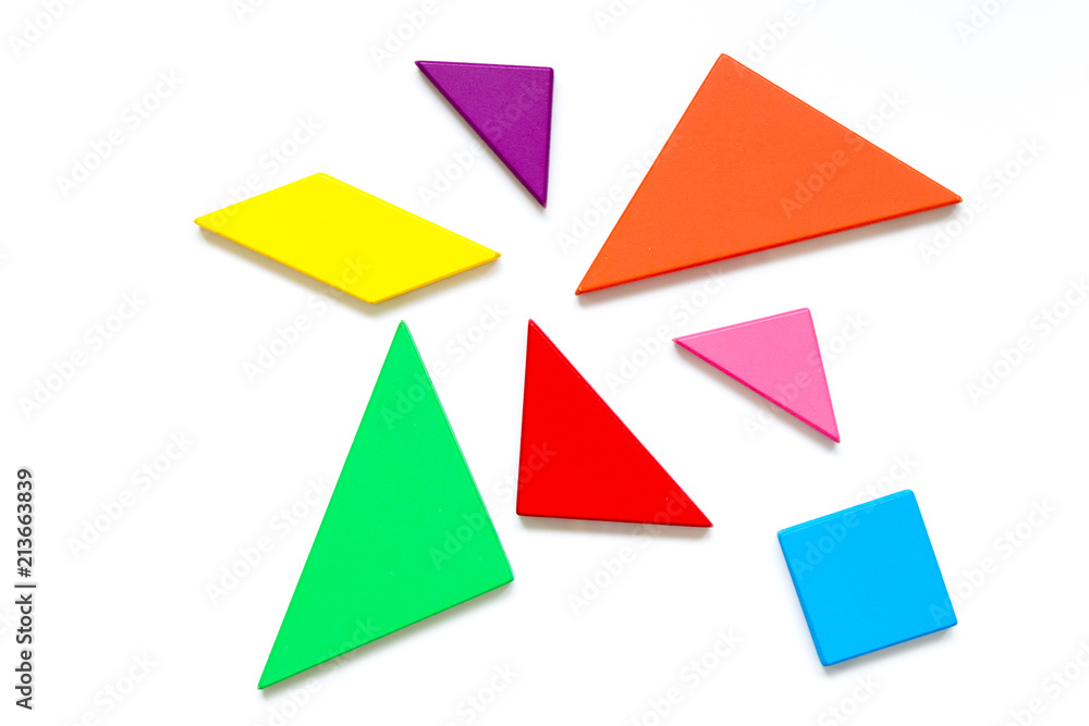 Color wood tangram puzzle in wait to build shape on white background Color wood tangram puzzle in wait to build shape on white background