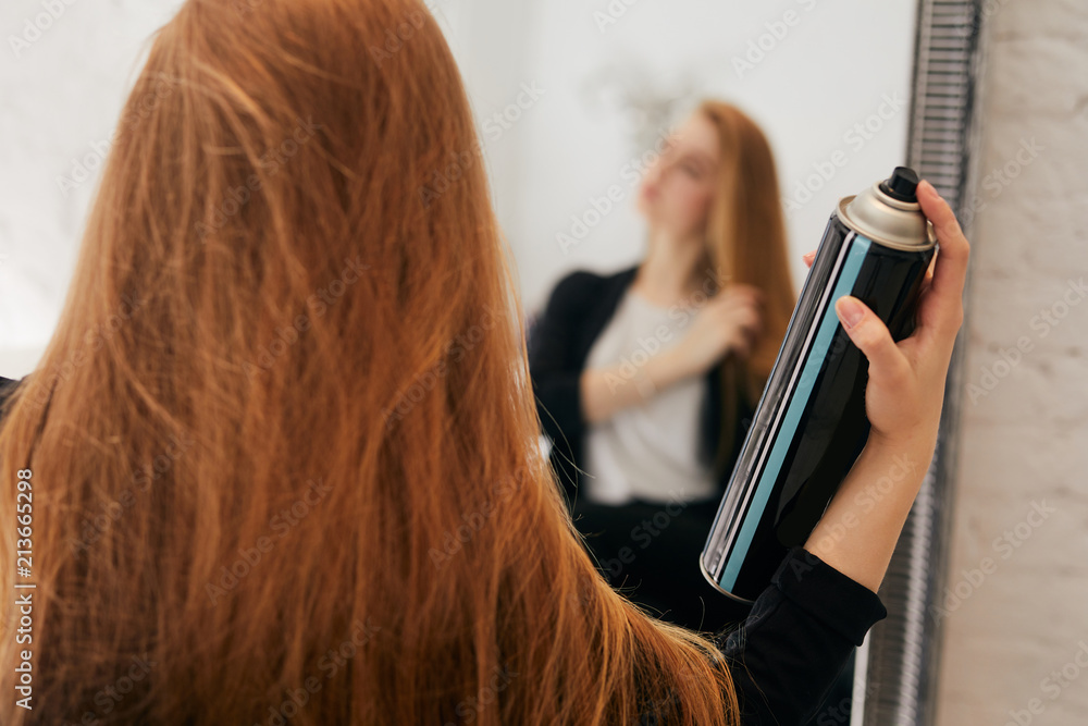 Girl taking care of her hair on hairdresser shop Girl taking care of her hair on hairdresser shop