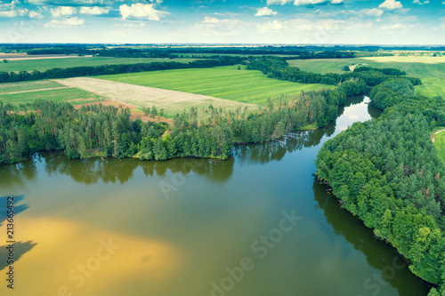 Aerial view of countryside and river. Forest along the river