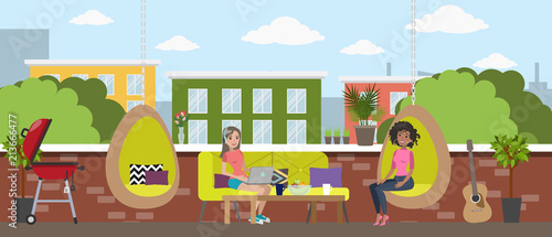 Young women chill out in the office break room