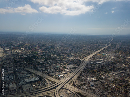 A Freeway with no end in sight travelling through neighborhoods