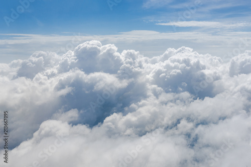 Fototapeta Naklejka Na Ścianę i Meble -  Clouds look through the plane window.