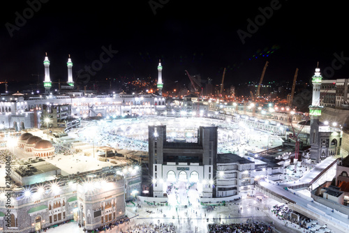 MECCA  SAUDI ARABIA - MAY 01 2018  View on Masjid Al Haram in Makkah from Abraj al Bait Tower at night with long exposure. Crowd of people on the square after Maghrib prayer