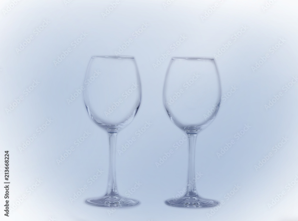 two transparent empty glasses on a long leg two transparent empty glasses on a long leg