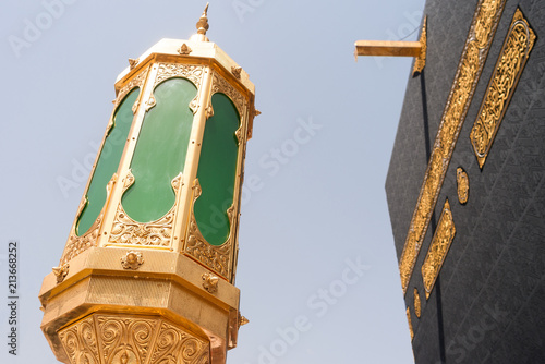 MECCA, SAUDI ARABIA - MAY 02 2018: The Holy Kaaba is the center of Islam inside Masjid Al Haram in Mecca. Covered with black silk cloth Kiswah with golden calligraphy in Arabic.
