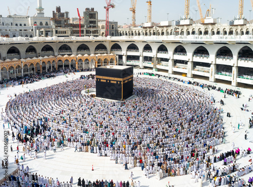 MECCA, SAUDI ARABIA - MAY 07 2018: Amazing and unique photo of people making Salah / Salat / Namaz shot at Asr prayer time. First rakaat, standing position, reading Al Fatiha prayer