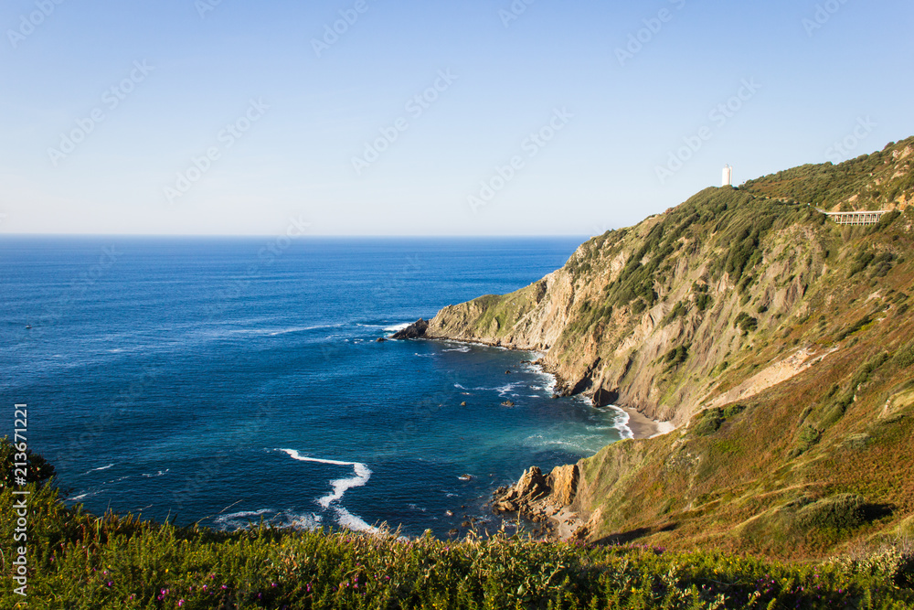 Great views of Cape Villano and Gorliz lighthouse on coast of Biscay by Cantabrian Sea, north Spain. Natural landscape, hiking adventure concepts