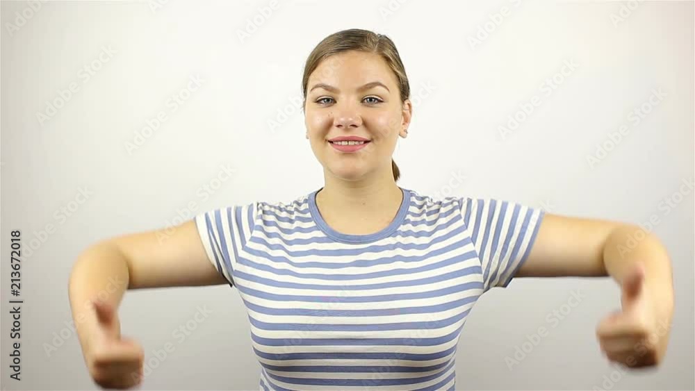 Beautiful young woman showing fingers successful Beautiful young woman showing fingers successful
