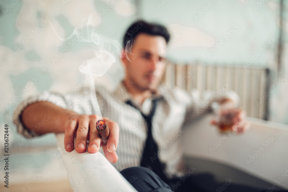 Businessman smoke cigar in bathtub, suicide man