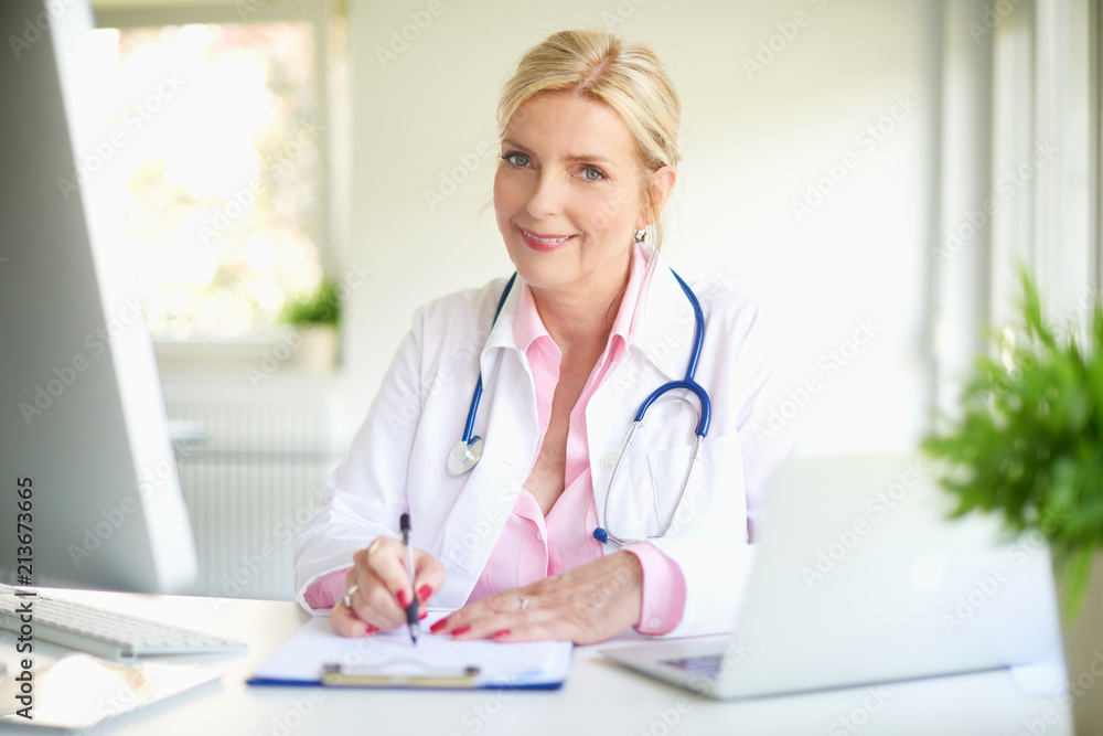 Smiling female doctor at work Smiling female doctor at work