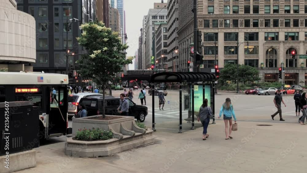 Intersection of North Wabash & Upper Wacker Dr in Chicago Downtown. CTA running in the background. Shot from the wall on the NE Corner of Wacker & Wabash. Wide Shot of intersection Intersection of North Wabash & Upper Wacker Dr in Chicago Downtown. CTA running in the background. Shot from the wall on the NE Corner of Wacker & Wabash. Wide Shot of intersection